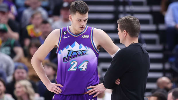 Utah Jazz center Walker Kessler (24) and head coach Will Hardy speak during a break first quarter action against the Boston Celtics at Vivint Arena.